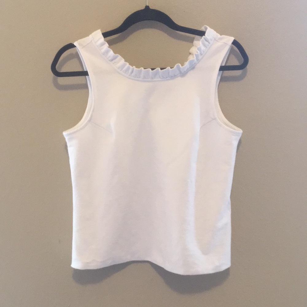 White ruffle sleeveless blouse